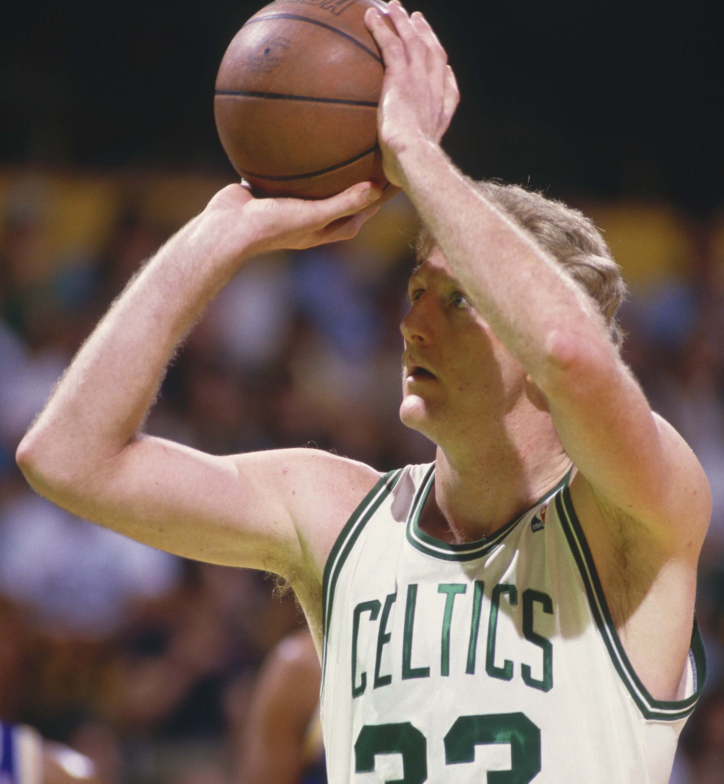 Former Boston Celtics star Larry Bird shoots a free throw.