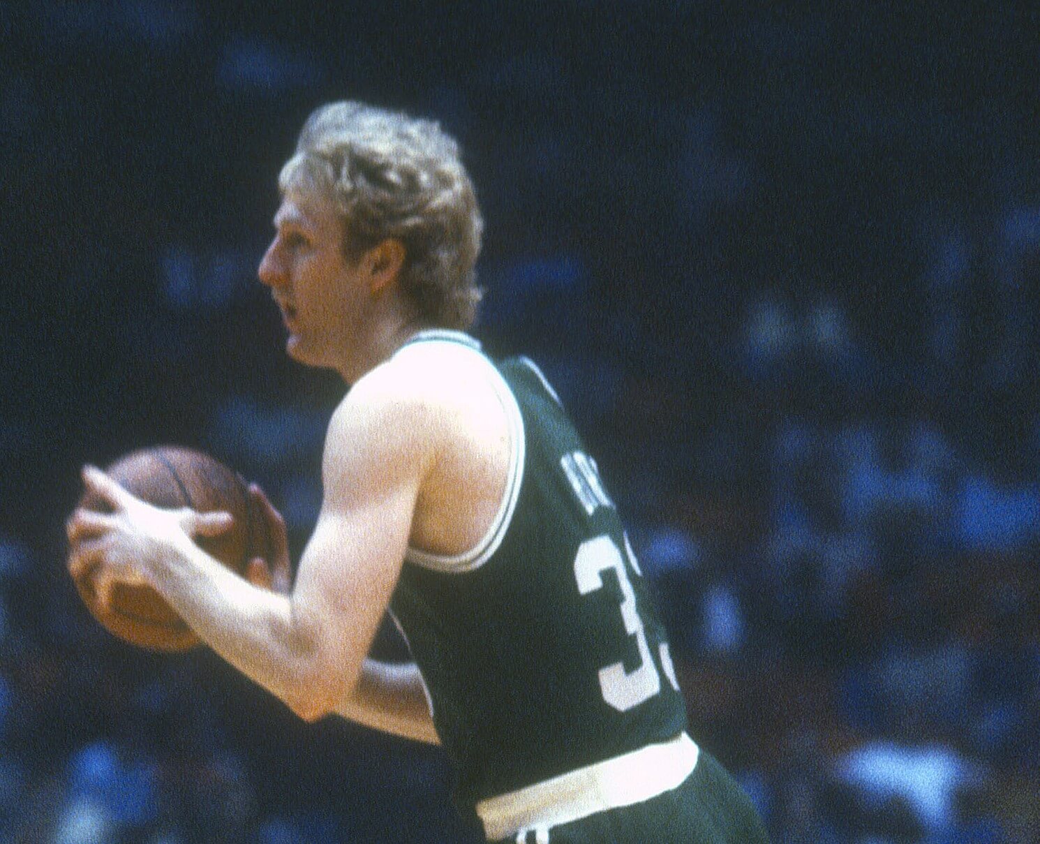 Larry Bird of the Boston Celtics looks to pass against the Houston Rockets.