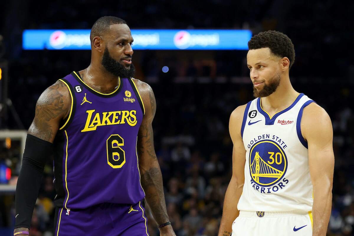 LeBron James of the Los Angeles Lakers speaks to Stephen Curry of the Golden State Warriors