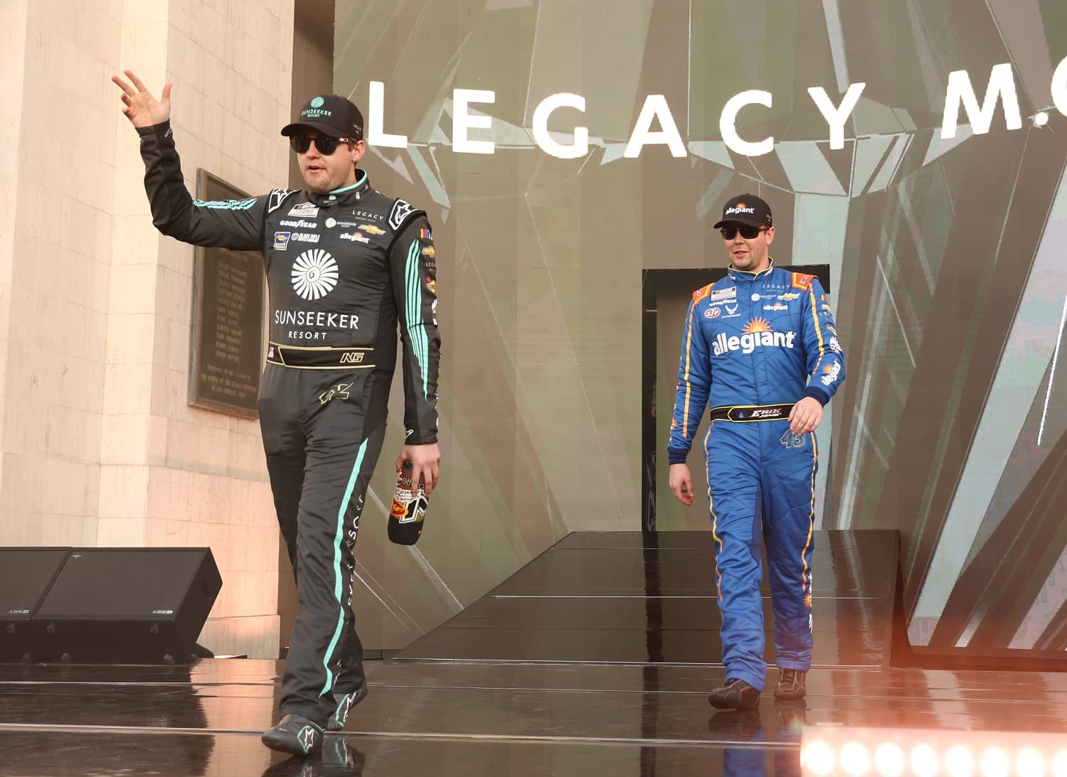 Noah Gragson and Erik Jones of Legacy Motor Club walk onstage during driver intros prior to the NASCAR Clash at the Coliseum at Los Angeles Memorial Coliseum on Feb. 5, 2023.