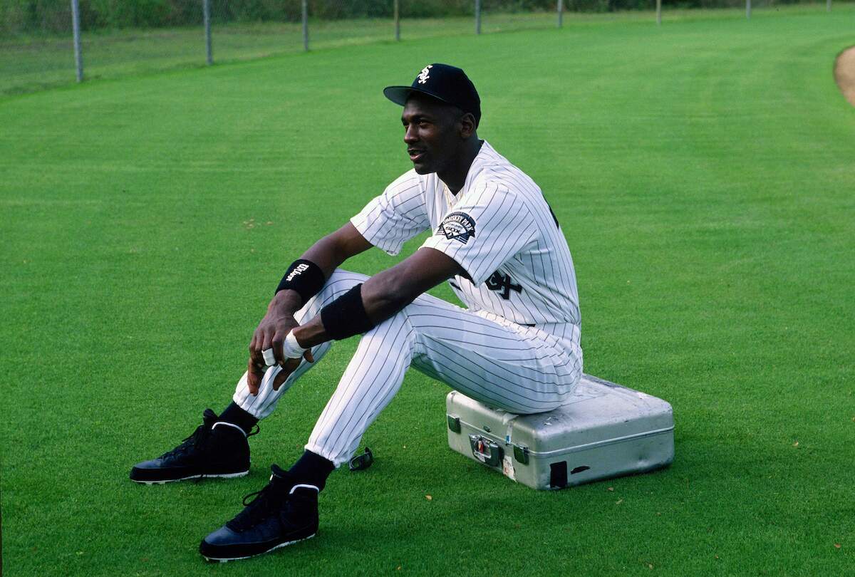 White Sox player Michael Jordan sits on the grass in the outfield