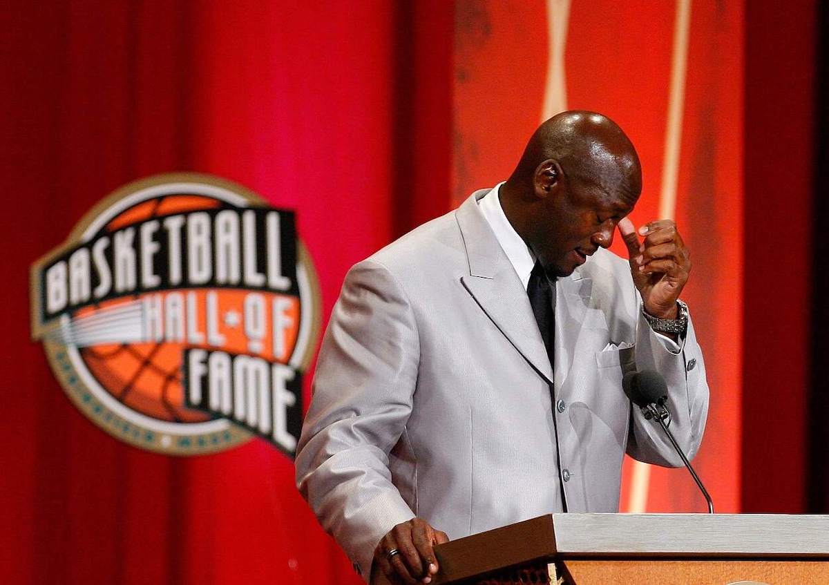 NBA legend Michael Jordan wipes his eyes during his Hall of Fame induction ceremony in 2009