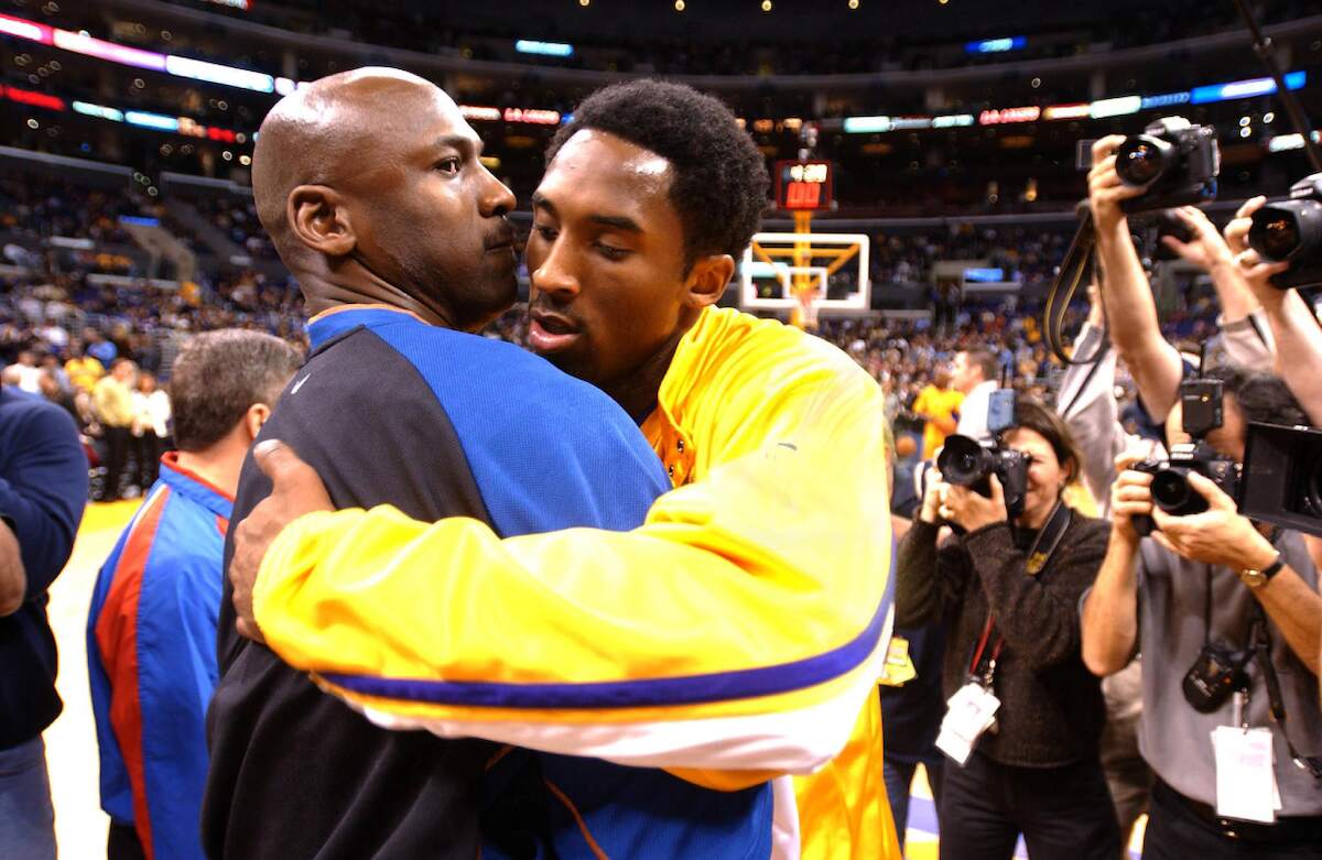 Michael Jordan and Kobe Bryant hug before a game