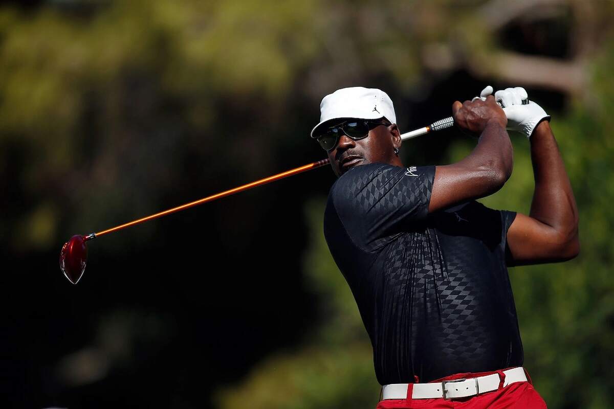 Retired NBA star Michael Jordan golfs