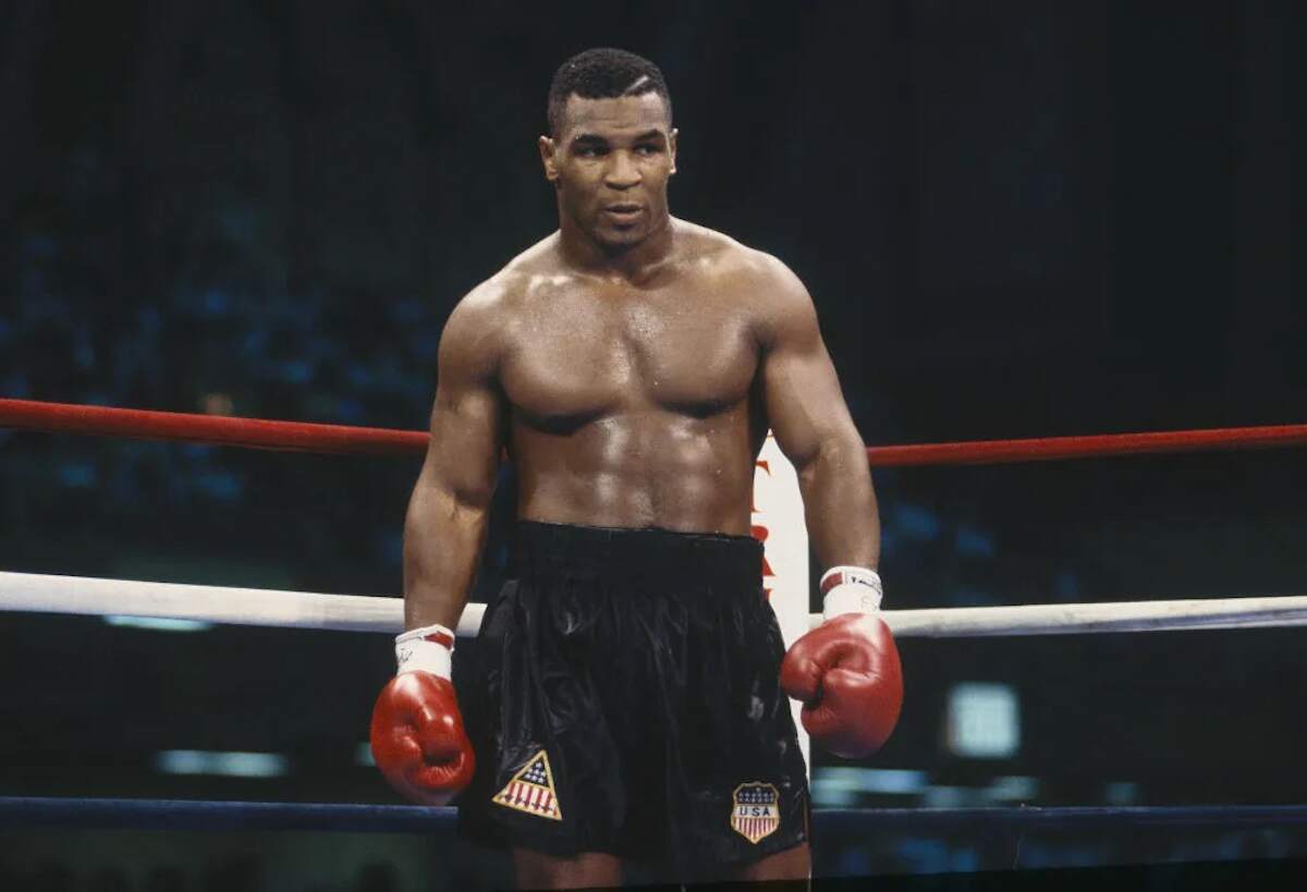 Boxer Mike Tyson stands in the ring during the fight with Carl Williams in 1989 in Atlantic City, New Jersey