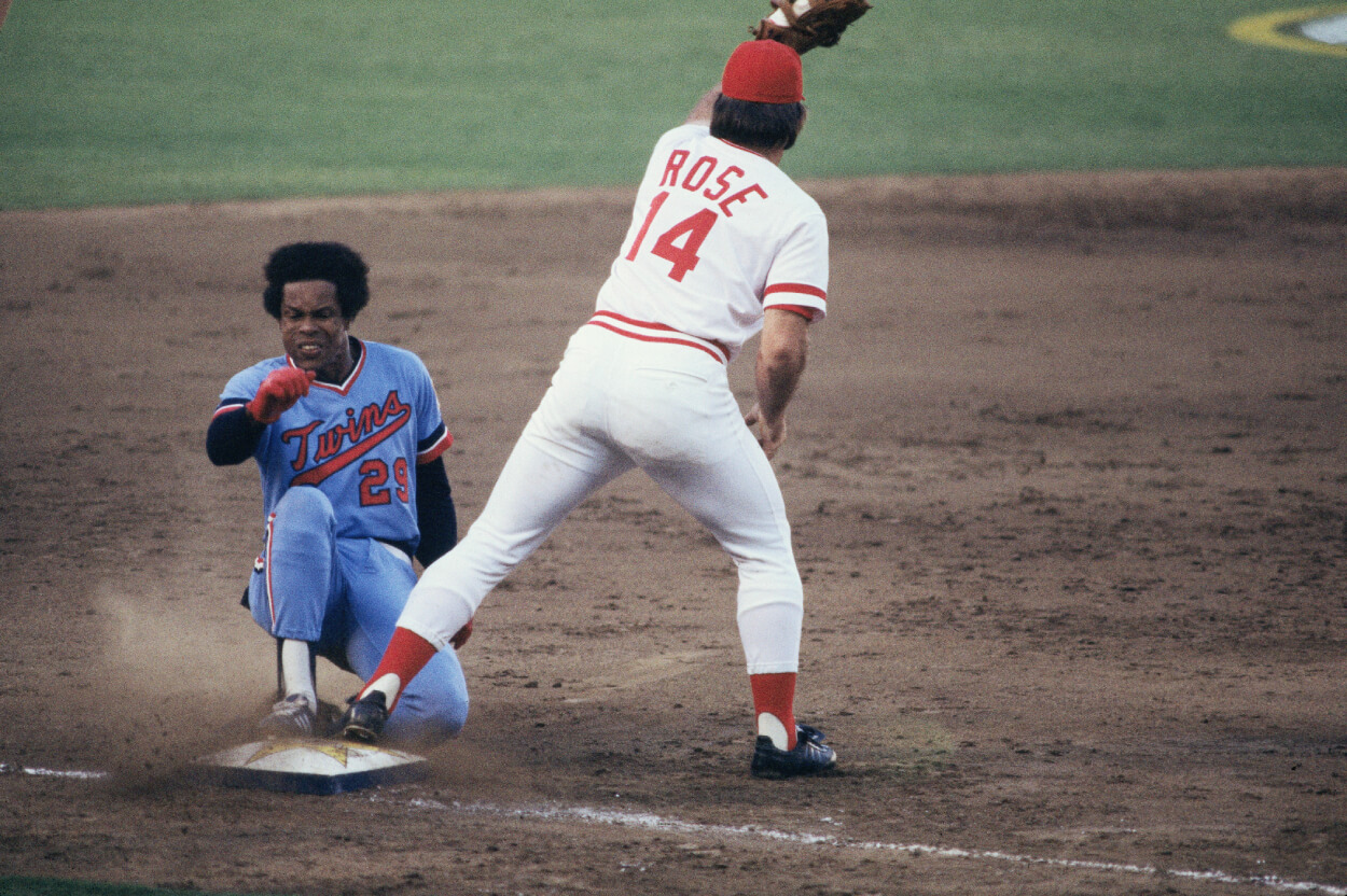 American League's Rod Carew slides in forhis second triple of the day as Cincinnati Reds' Pete Rose waits for the throw.