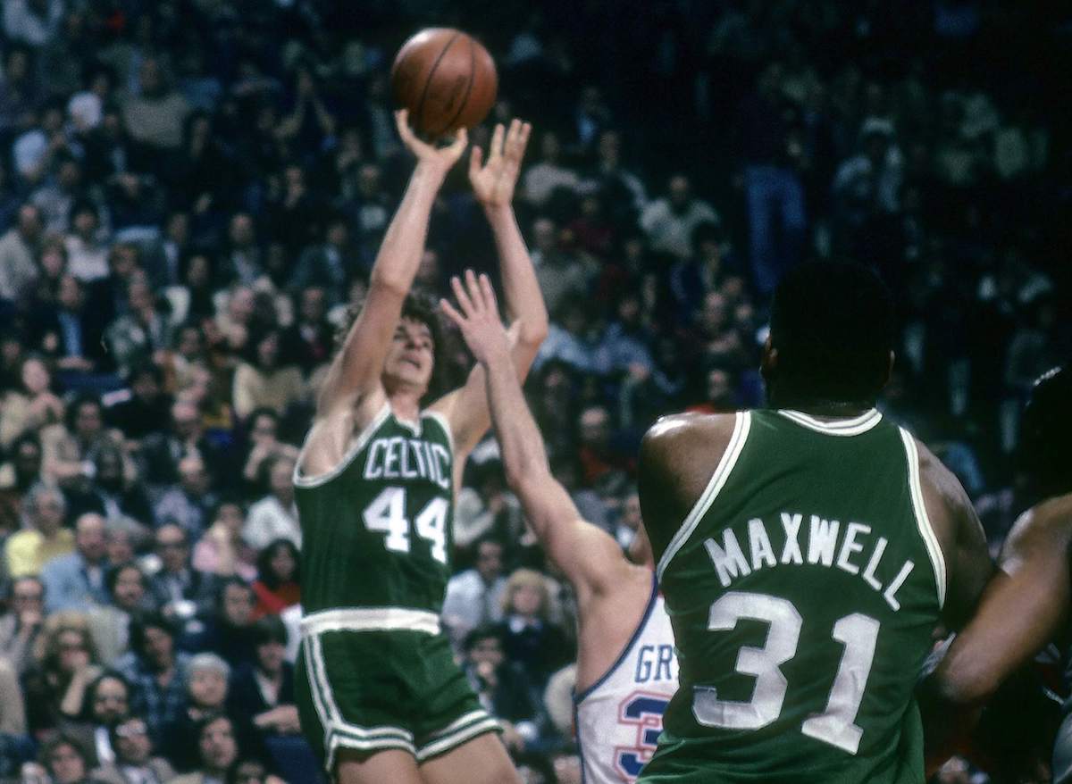 Pete Maravich of the Boston Celtics shoots over Kevin Grevey of the Washington Bullets during a late-'70s NBA game