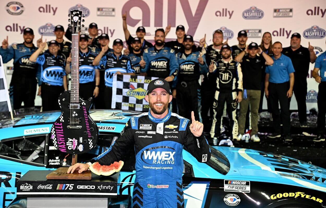 Ross Chastain, driver of the #1 Worldwide Express Chevrolet, and his Trackhouse Racing crew celebrate in victory lane after winning the NASCAR Cup Series Ally 400 at Nashville Superspeedway on June 25, 2023 in Lebanon, Tennessee
