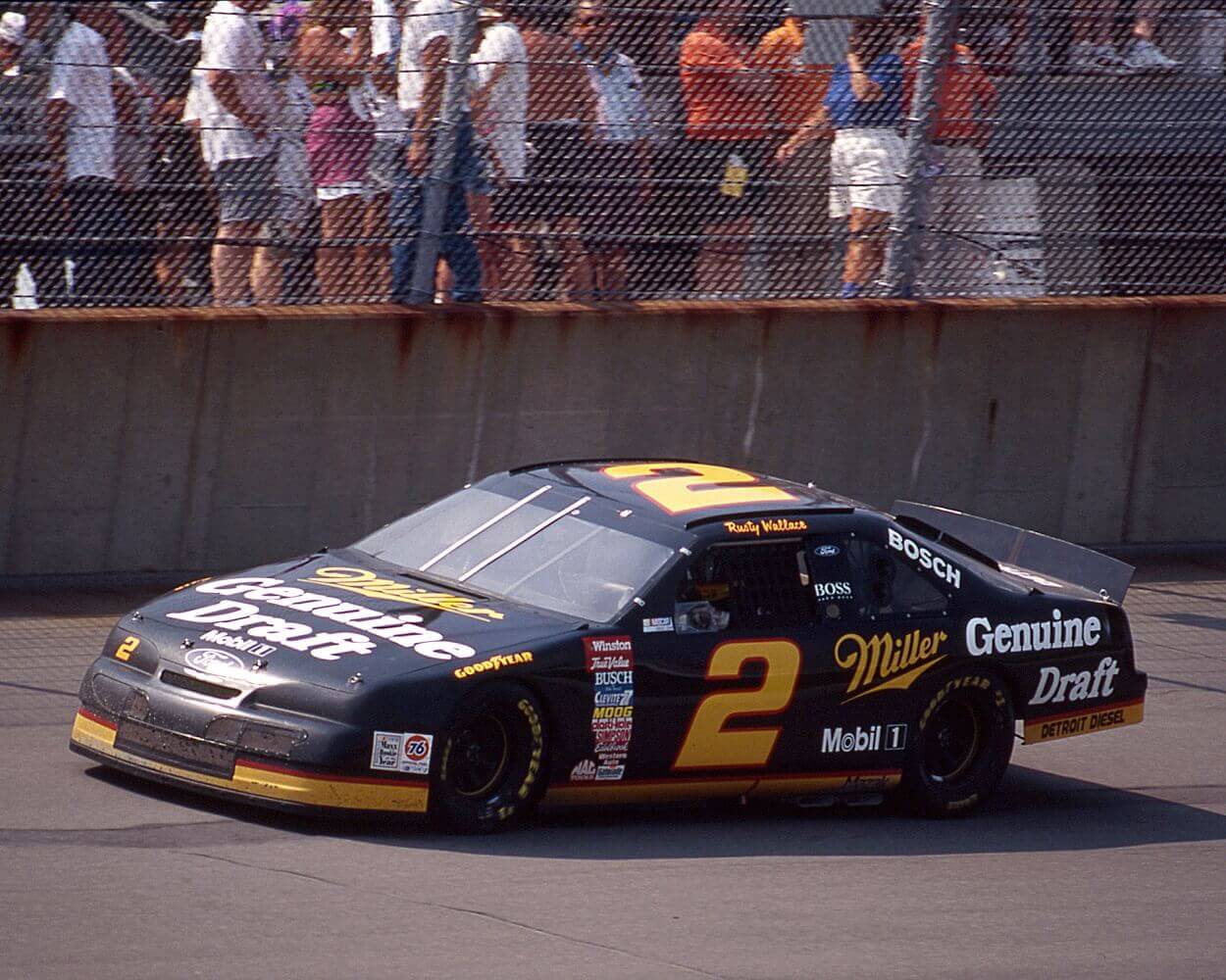 Rusty Wallace at the wheel of Roger Penske's Miller Genuine Draft Ford Thunderbird on his way to winning his sponsor's race, the Miller Genuine Draft 400 NASCAR Cup race at Michigan International Speedway