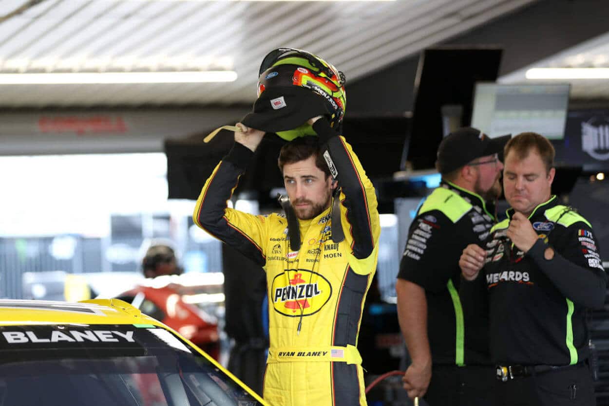 Ryan Blaney poses after claiming victory at Charlotte Motor Speedway.