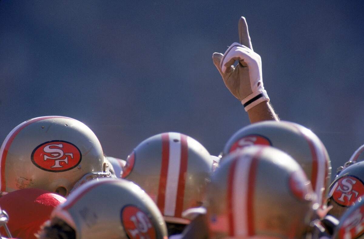 A details shot of the San Francisco 49ers helmets in the huddle