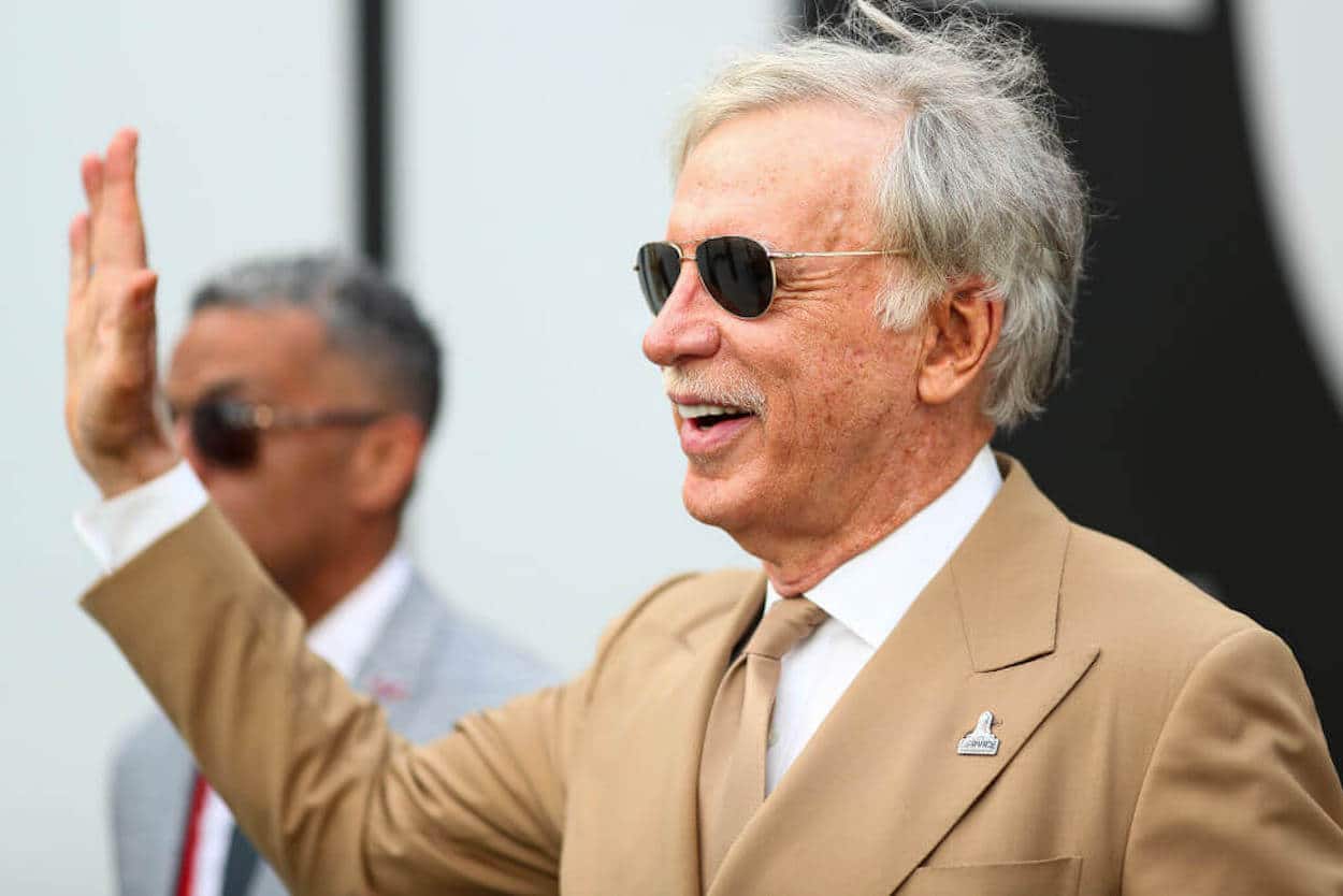 Stan Kroenke waves to the crowd during a 2022 NFL game.