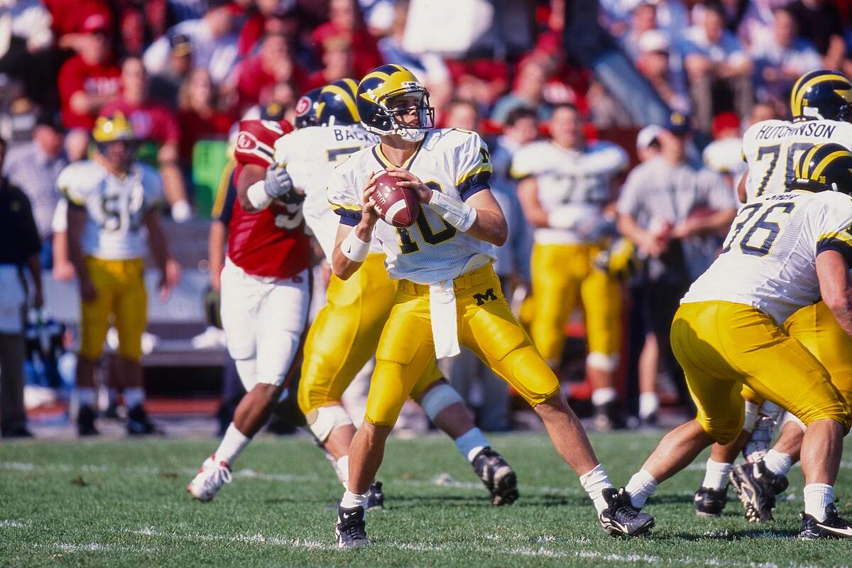 Michigan quarterback Tom Brady throws a pass
