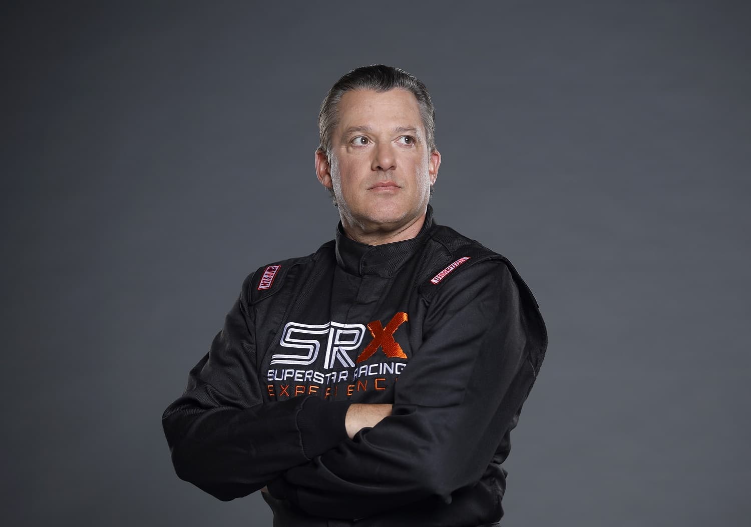 Tony Stewart poses for a photo during the Superstar Racing Experience portrait shoot at Clutch Studios on April 25, 2023 in Huntersville, North Carolina.