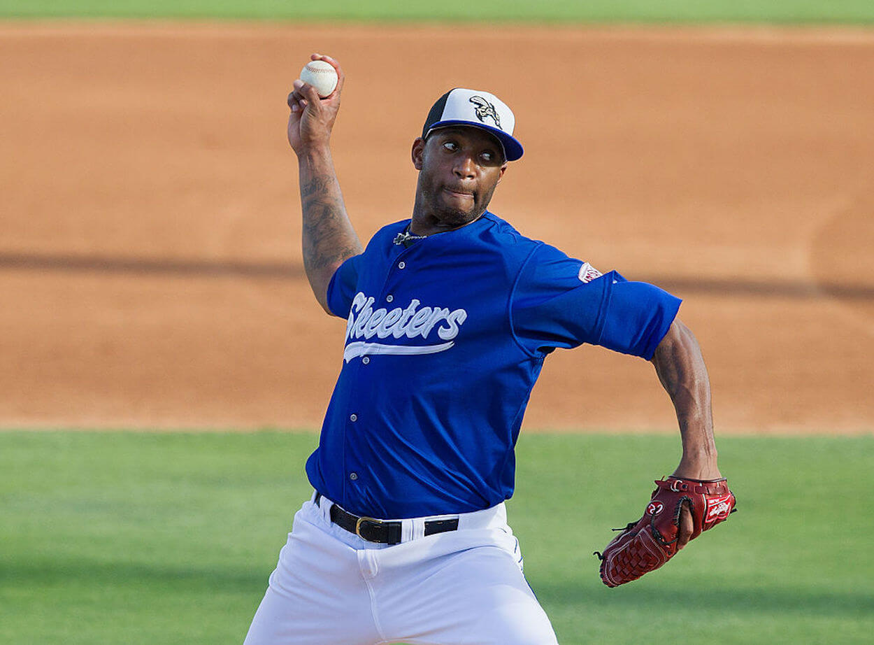 Tracy McGrady pitches during his time playing