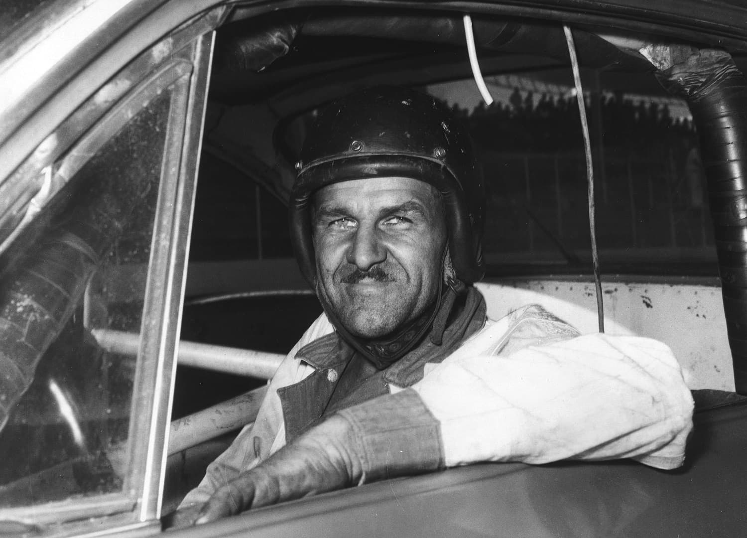 Wendell Scott sits in his car before a race at Martinsville Speedway circa 1963. | ISC Archives/CQ-Roll Call Group via Getty Images