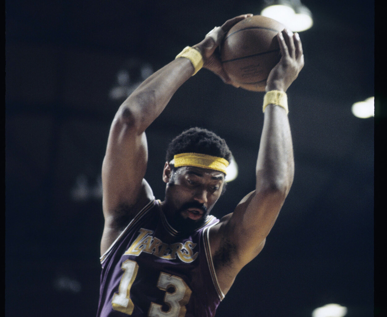Wilt Chamberlain of the Los Angeles Lakers grabs a rebound.