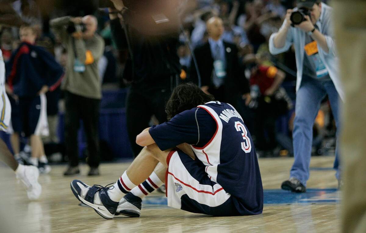 Adam Morrison sits on the floor after Gonzaga lost to UCLA in the NCAA Tournament