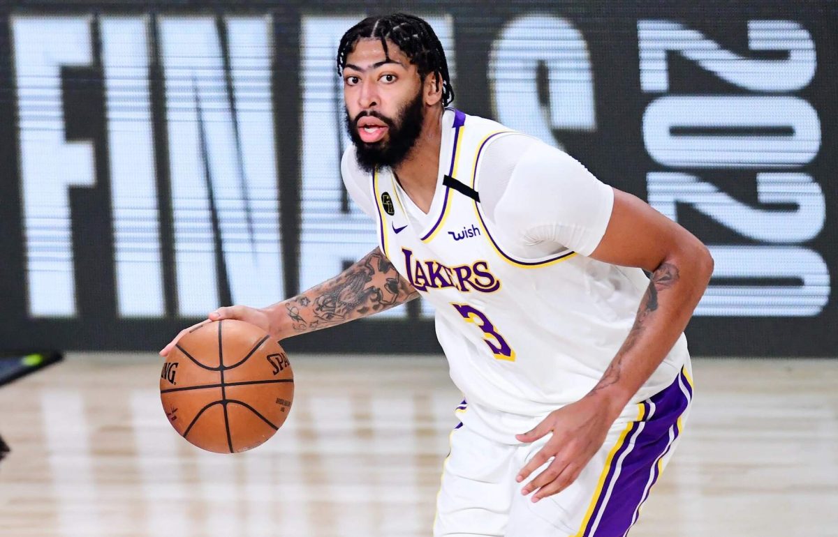 Lakers player Anthony Davis dribbles the basketball down the court