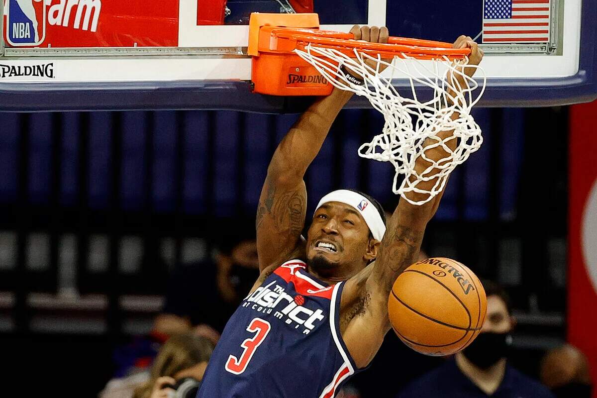 Then-Wizards player Bradley Beal executes a slam dunk