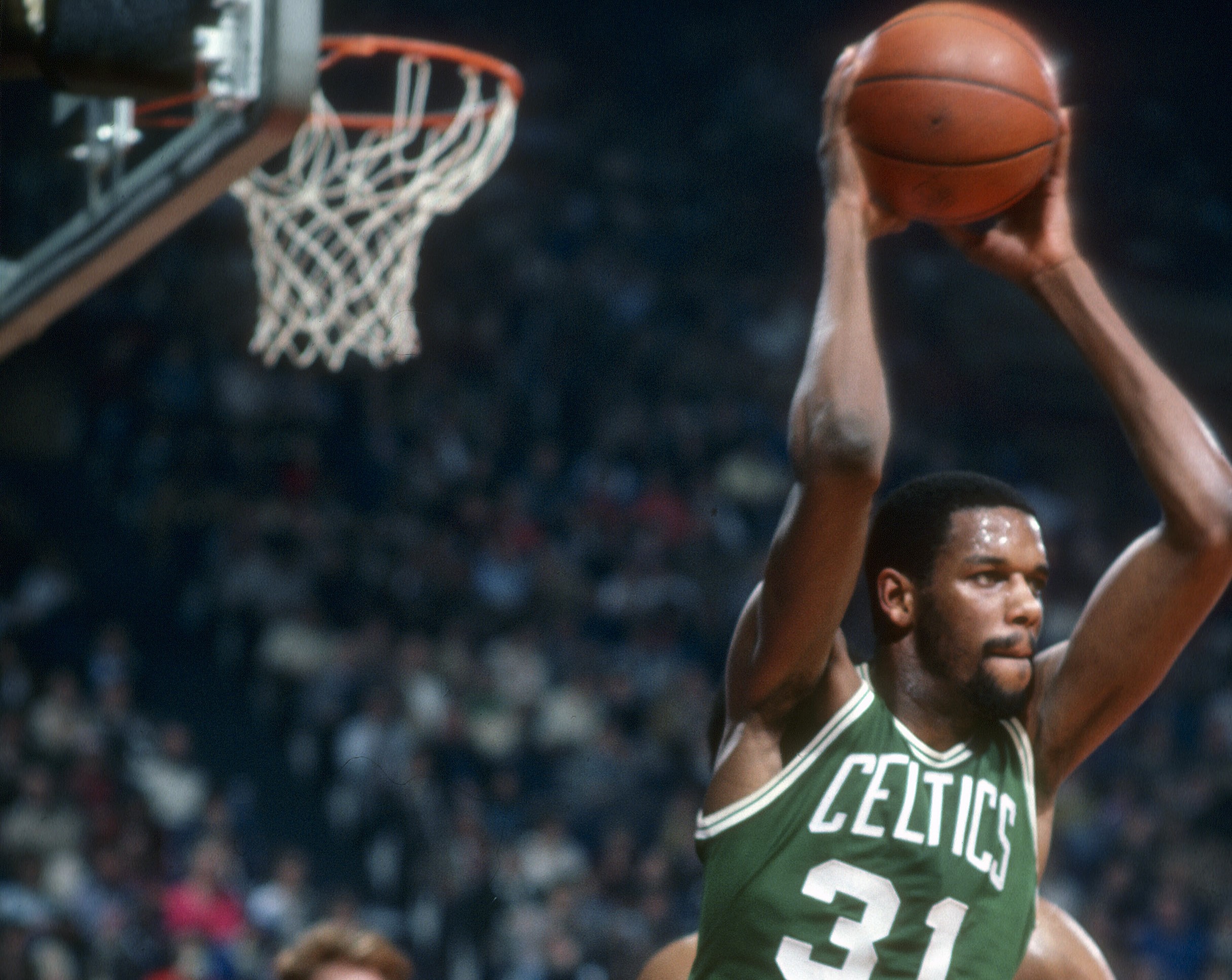 Cedric Maxwell of the Boston Celtics looks to pass against the Washington Bullets.