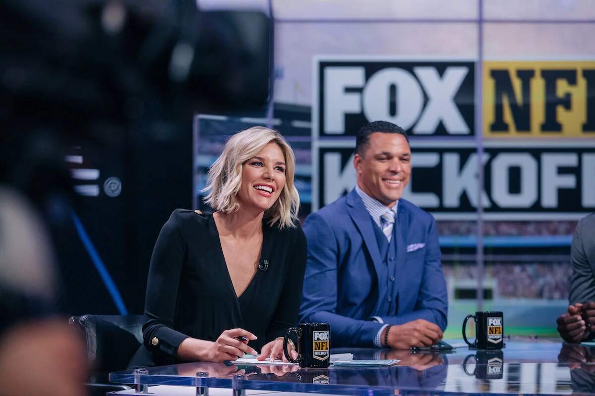 FOX NFL host Charissa Thompson laughs during a broadcast with Tony Gonzalez