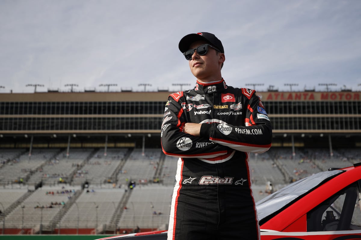 Christopher Bell looks on at a NASCAR track.