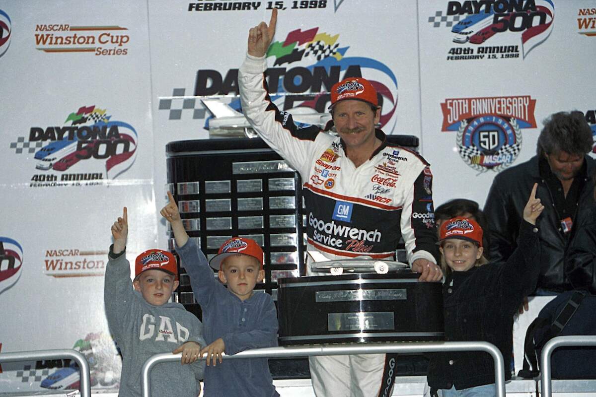 NASCAR driver Dale Earnhardt points into the air after winning the 1998 Daytona 500