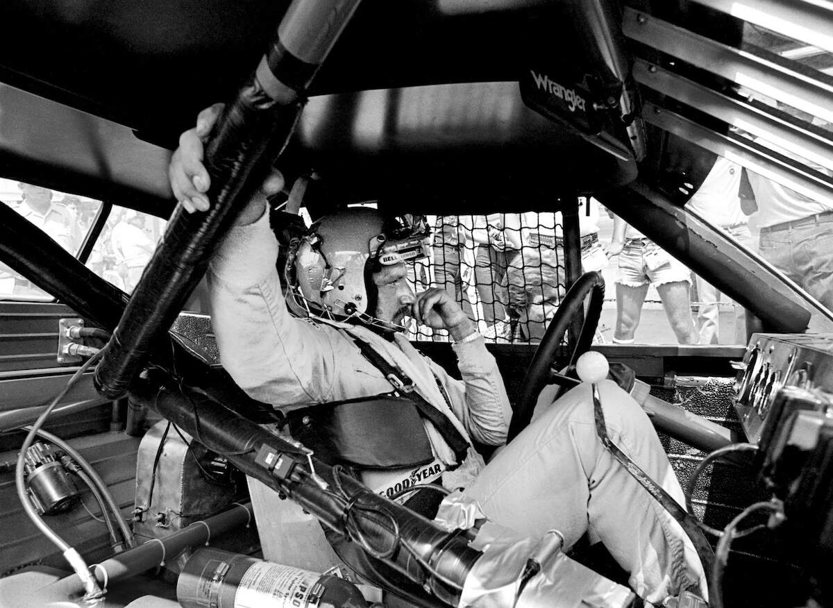 NASCAR legend Dale Earnhardt Sr. sits in his car at Daytona International Speedway