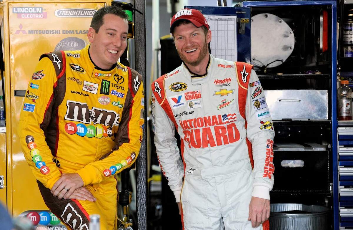 Kyle Busch and Dale Earnhardt Jr. laugh together during a media event in 2014