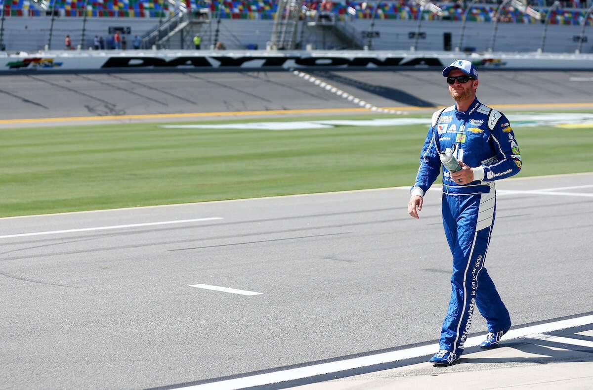 Dale Earnhardt Jr., driver of the #88 Nationwide Chevrolet, walks on the grid during qualifying for the Monster Energy NASCAR Cup Series 59th Annual Coke Zero 400 at Daytona International Speedway in 2017
