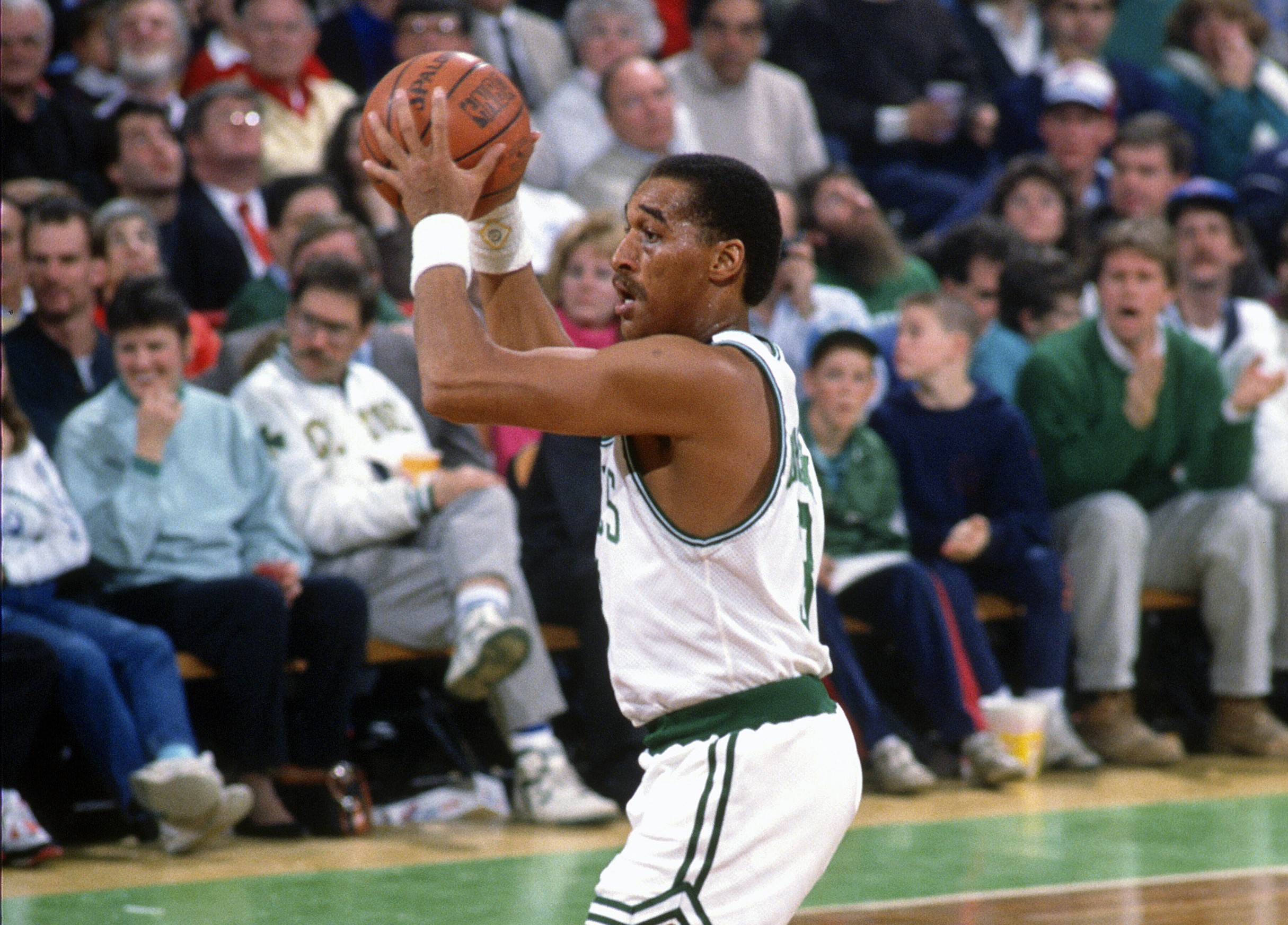 Dennis Johnson of the Boston Celtics looks to pass the ball.