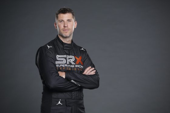 SRX driver Denny Hamlin poses for photo.