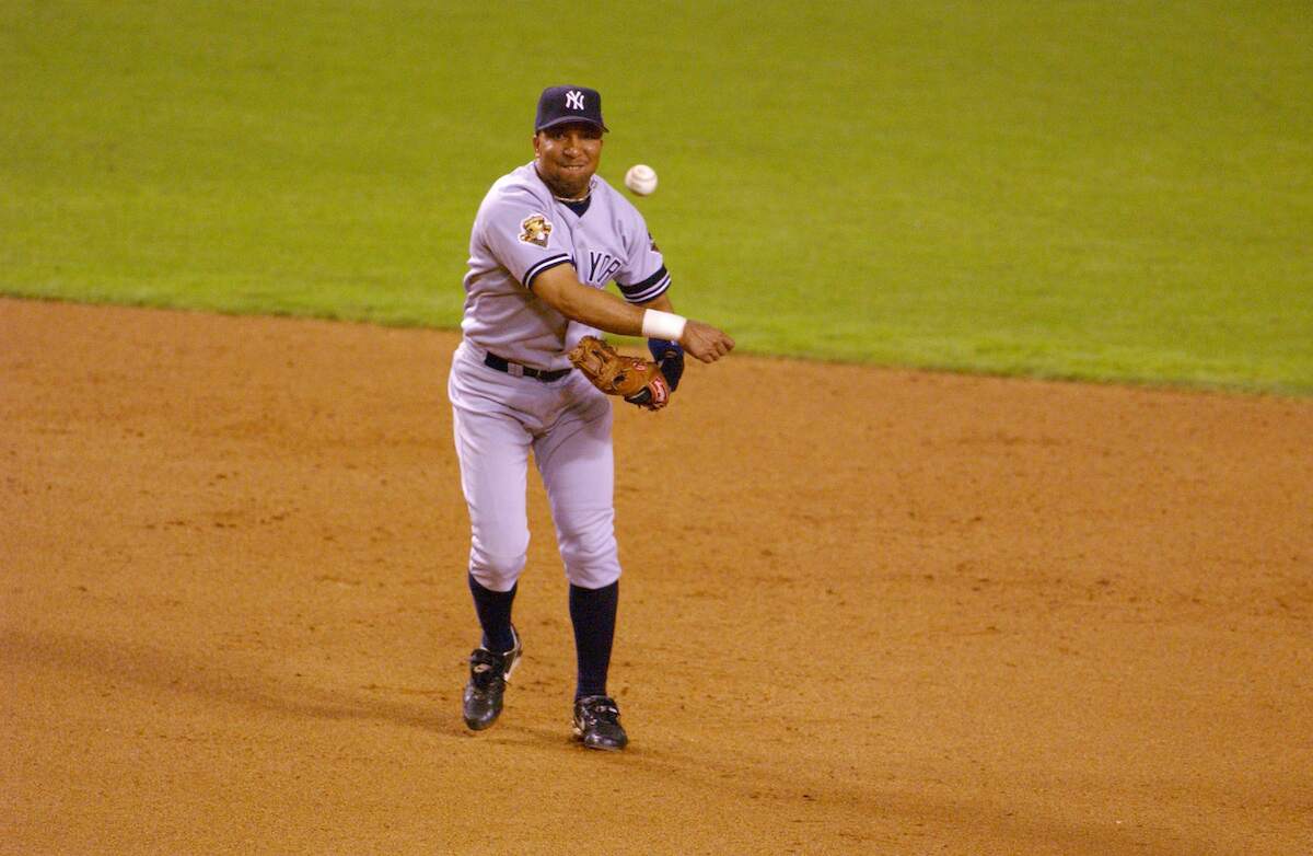 Enrique Wilson of New York Yankees throws to first base