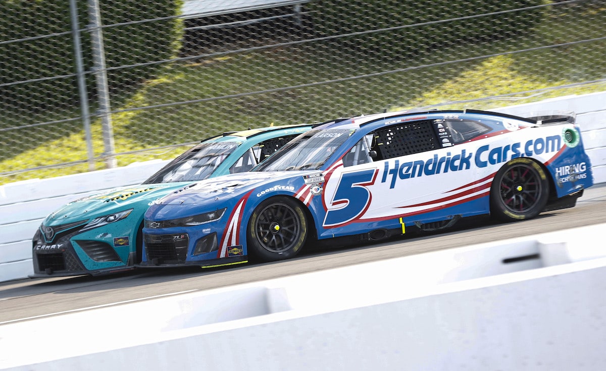 Denny Hamlin and Kyle Larson race side-by-side at Pocono.