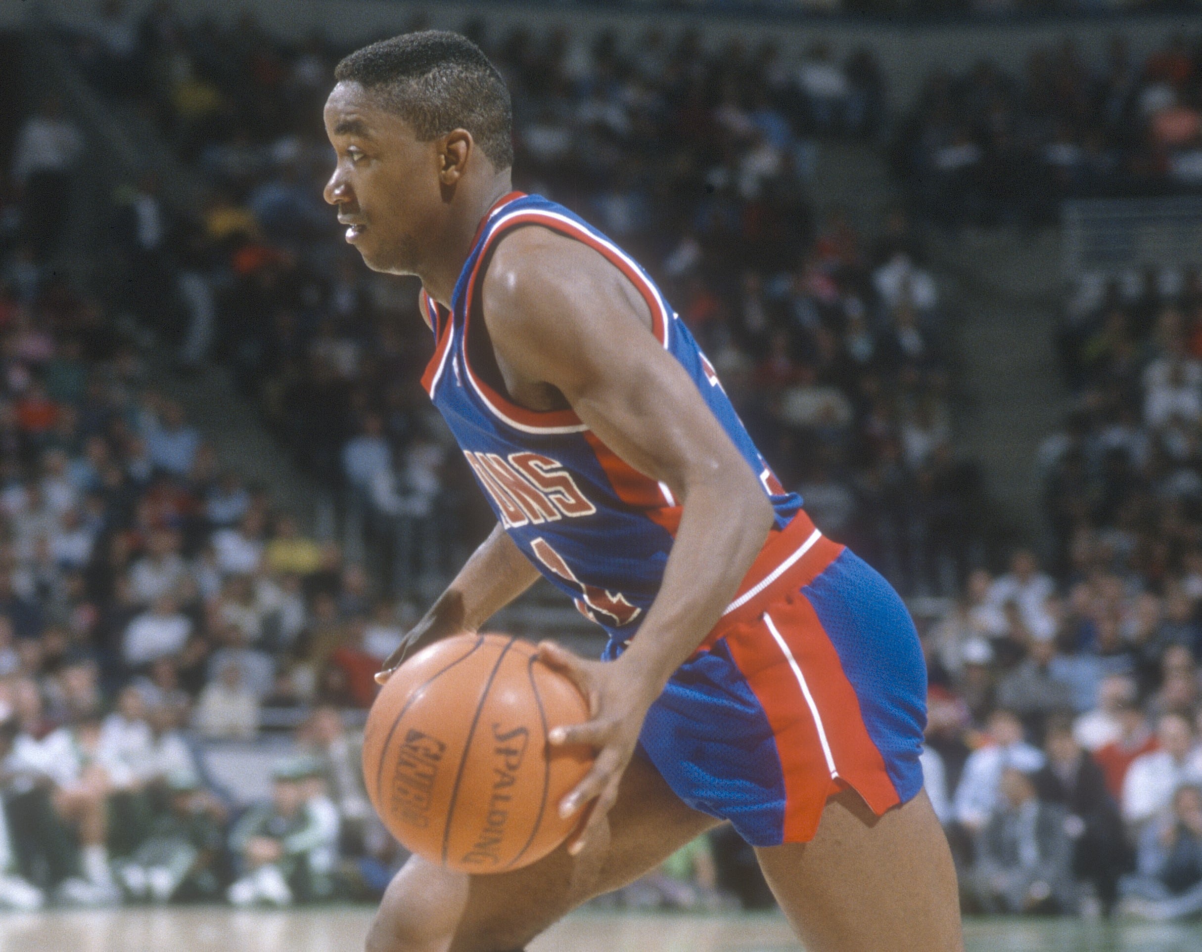 Isiah Thomas of the Detroit Pistons dribbles the ball against the Milwaukee Bucks.