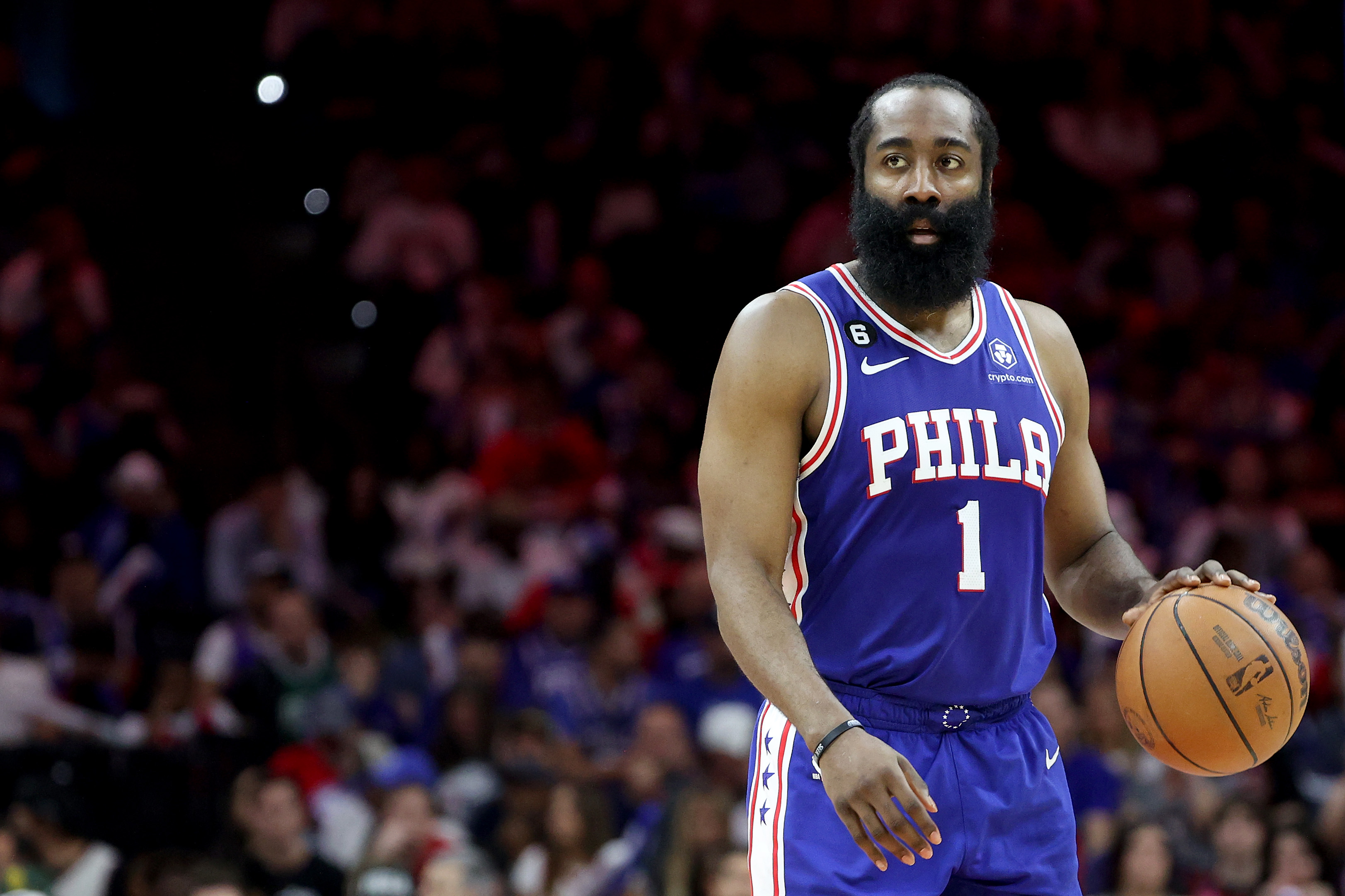 James Harden of the Philadelphia 76ers dribbles against the Boston Celtics.