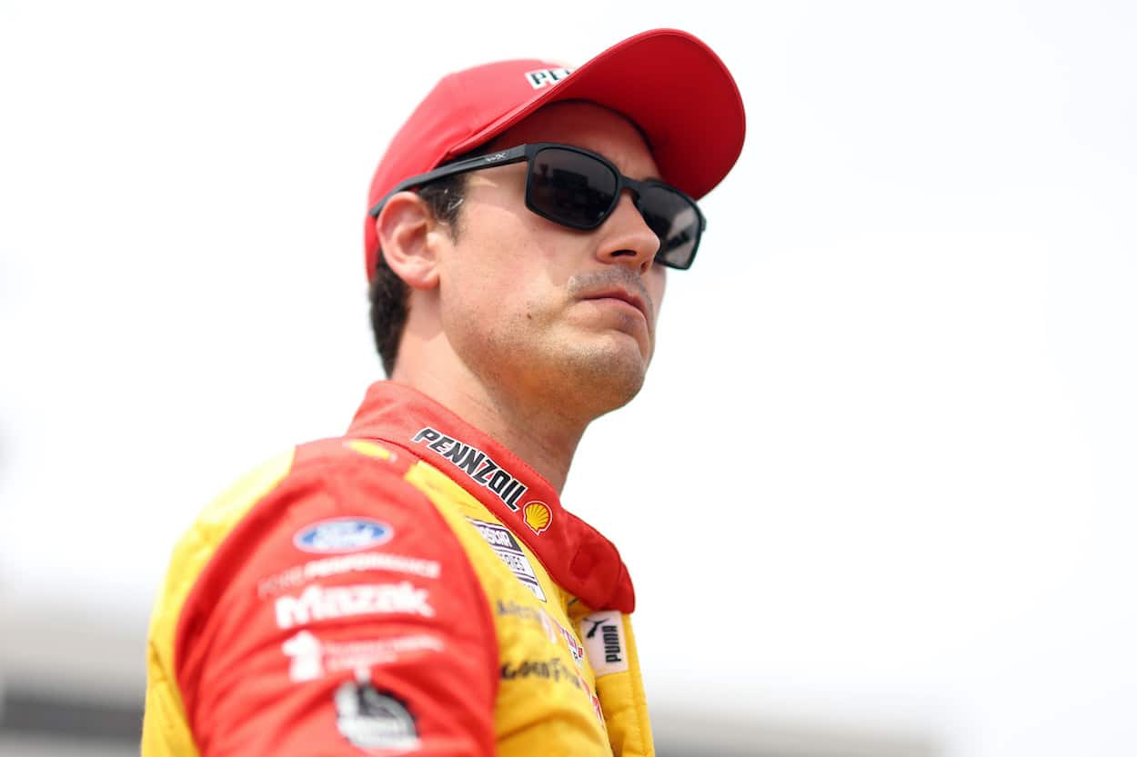 Joey Logano watches qualifying.