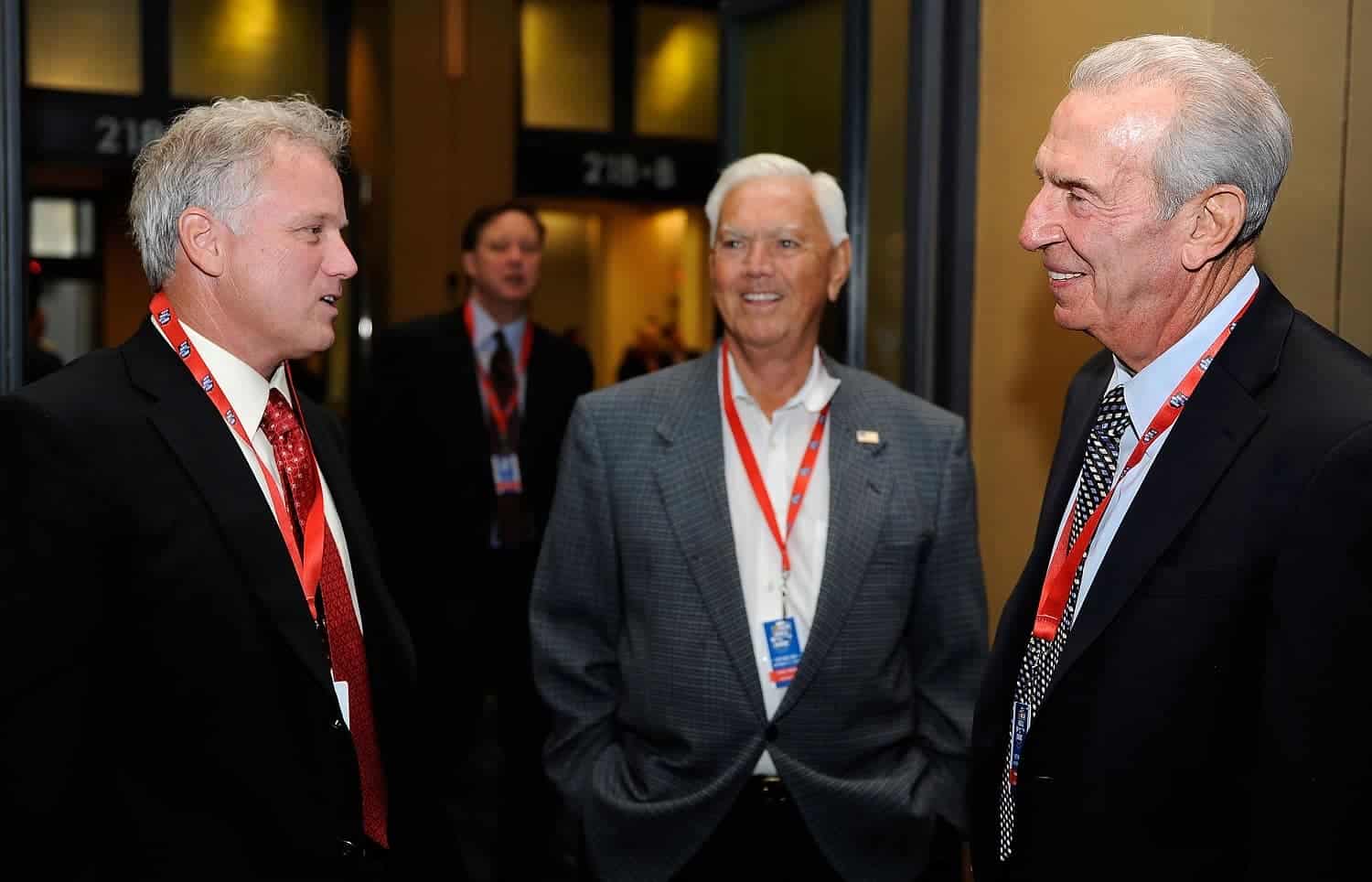 Former driver Ricky Rudd speaks with NASCAR Hall of Famers Junior Johnson and Ned Jarrett during NASCAR Hall of Fame Voting Day on Oct. 13, 2010.