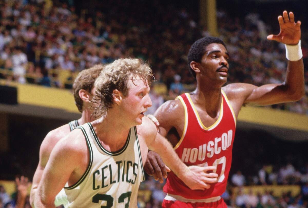 NBA players Larry Bird and Ralph Sampson compete during a basketball game