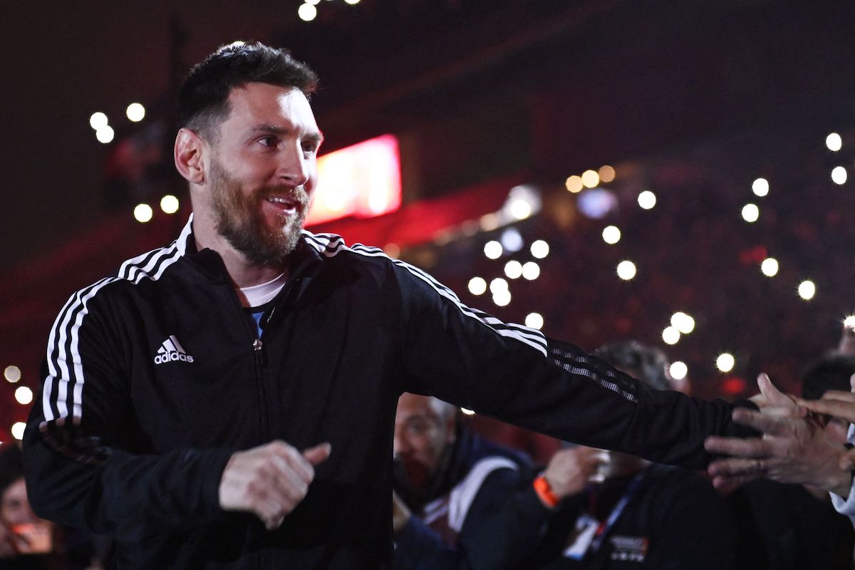 Lionel Messi greets fans.