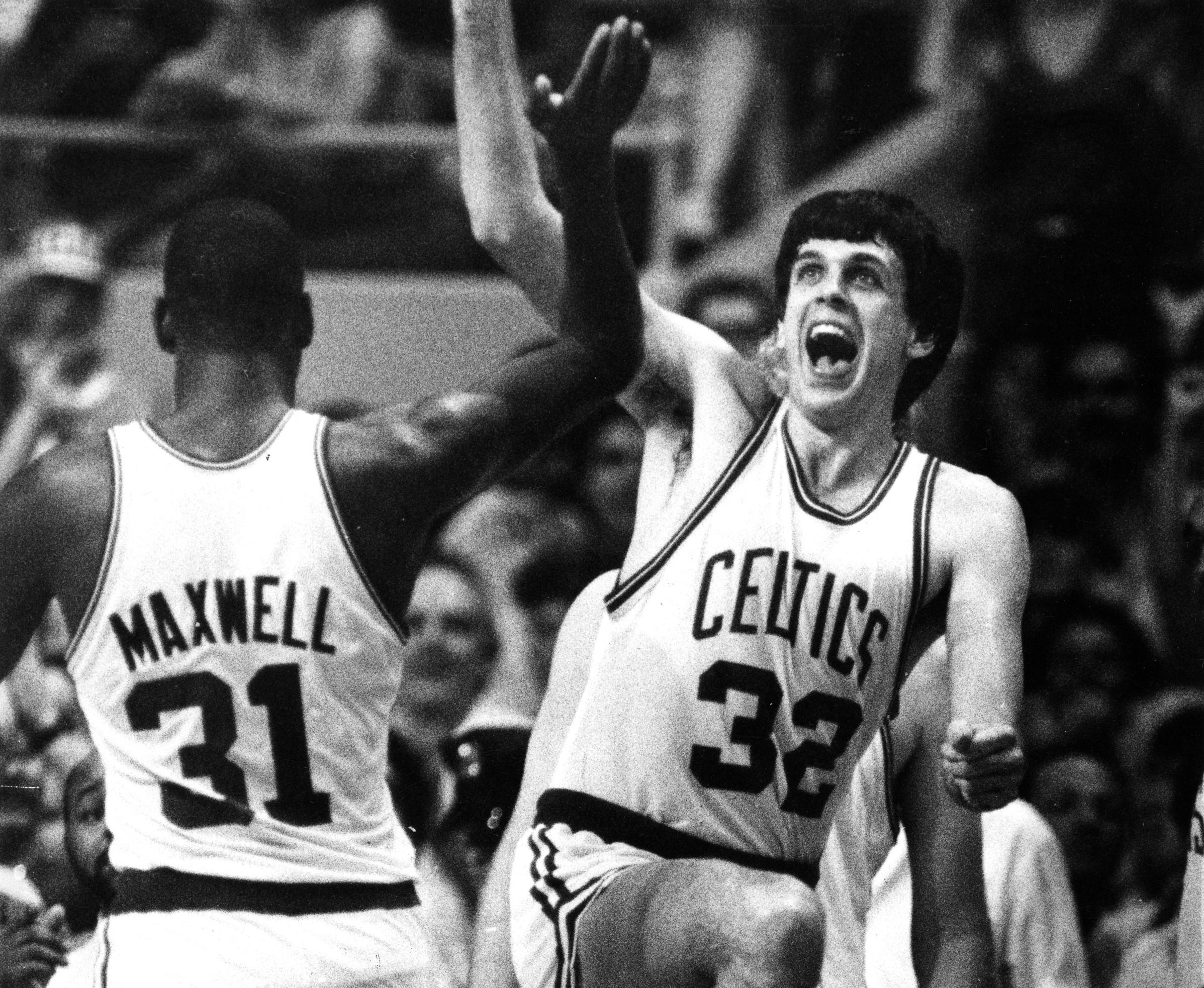 Boston Celtics forward Kevin McHale, right, and Cedric Maxwell high-five during Game 5 of the 1984 NBA Finals.