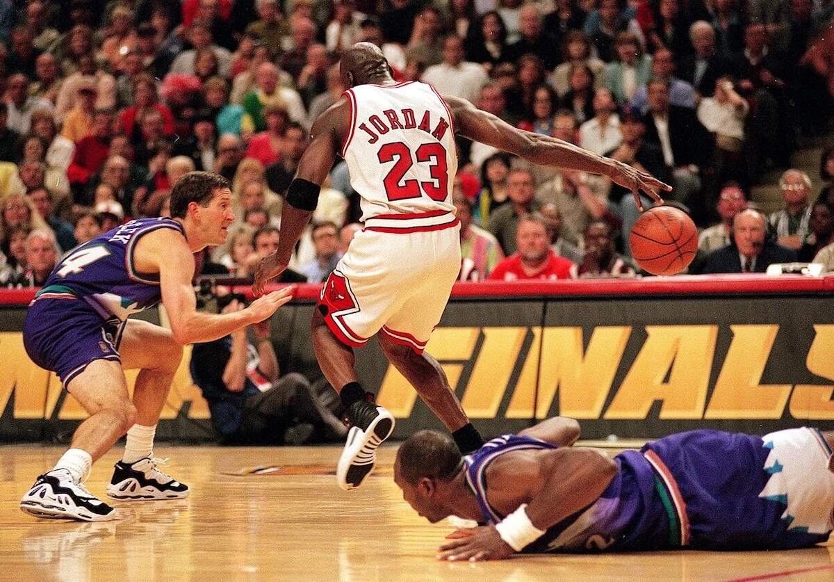 Bulls star Michael Jordan battles the Utah Jazz