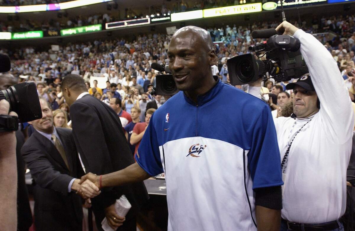Michael Jordan of the Washington Wizards shakes hands with fans in 2003