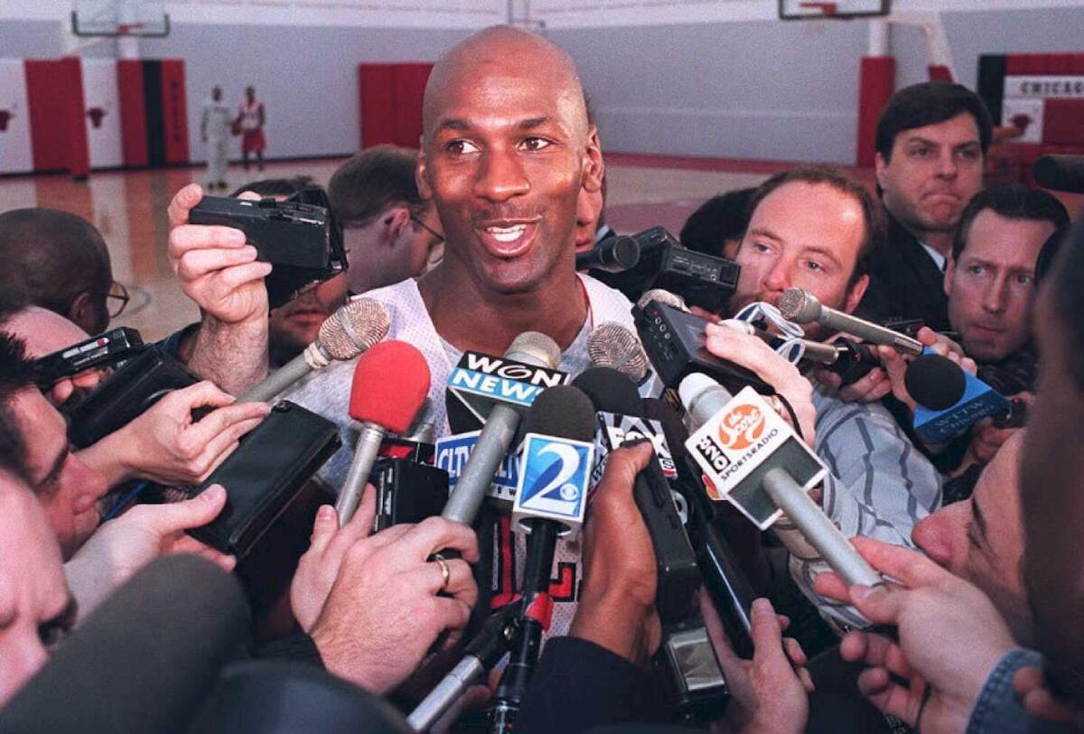 Michael Jordan of the Chicago Bulls talks to the press