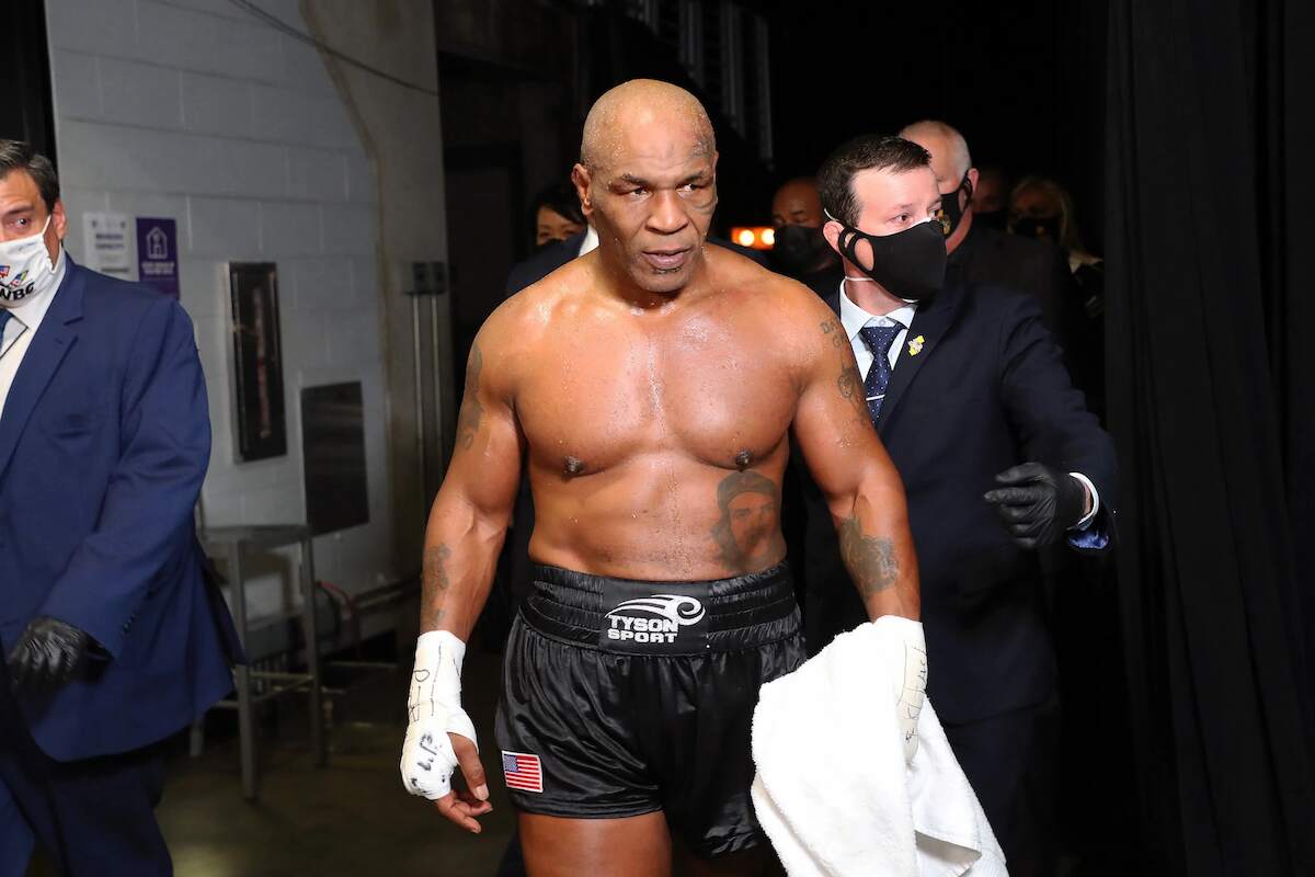 Mike Tyson exits the ring after receiving a split draw against Roy Jones Jr. in 2020