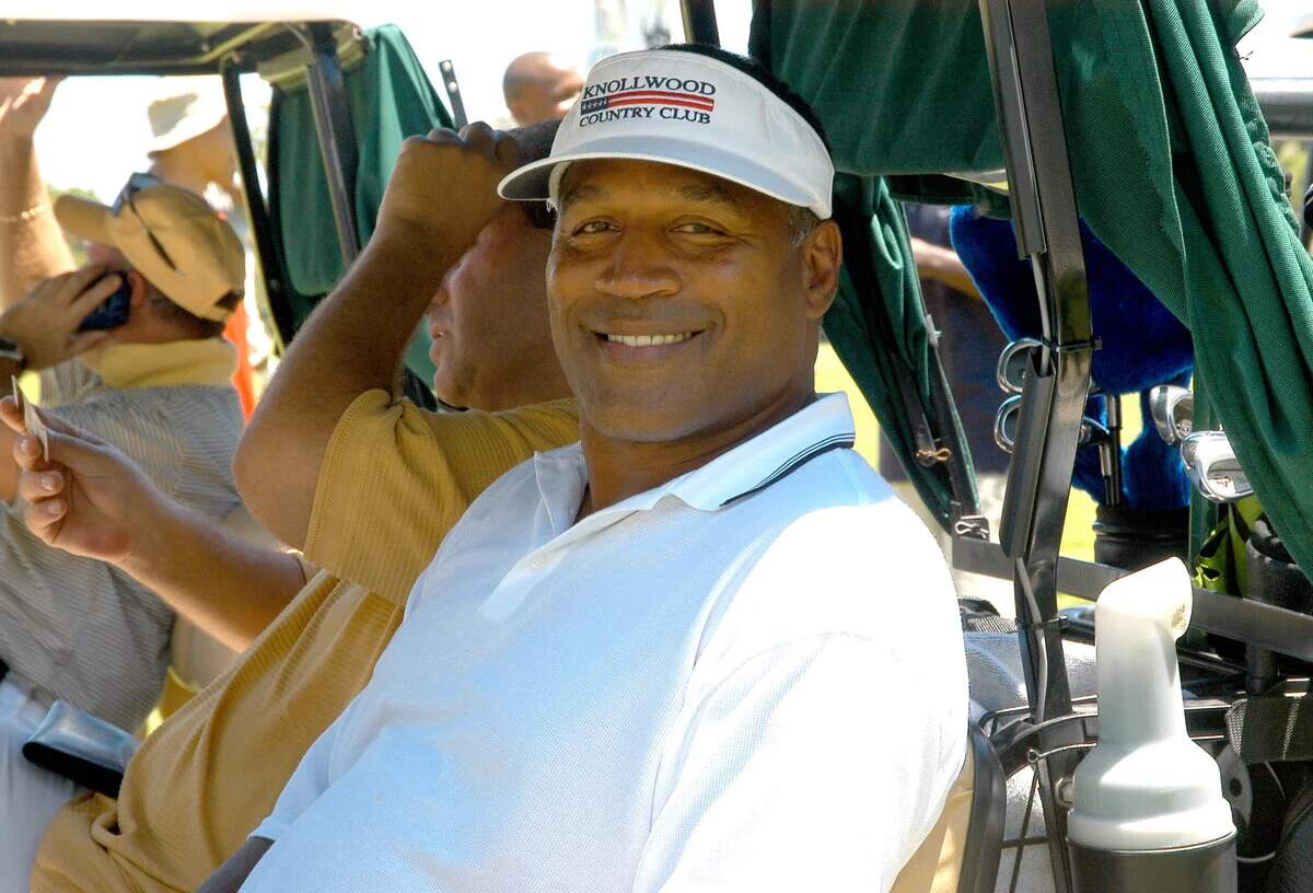 Buffalo Bills legend O.J. Simpson smiles for a camera during a golf competition