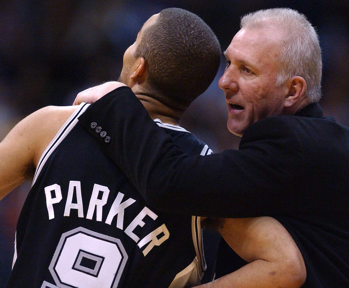 San Antonio Spurs coach Gregg Popovich (R) hugs Spurs French player Tony Parker after a 2003 win