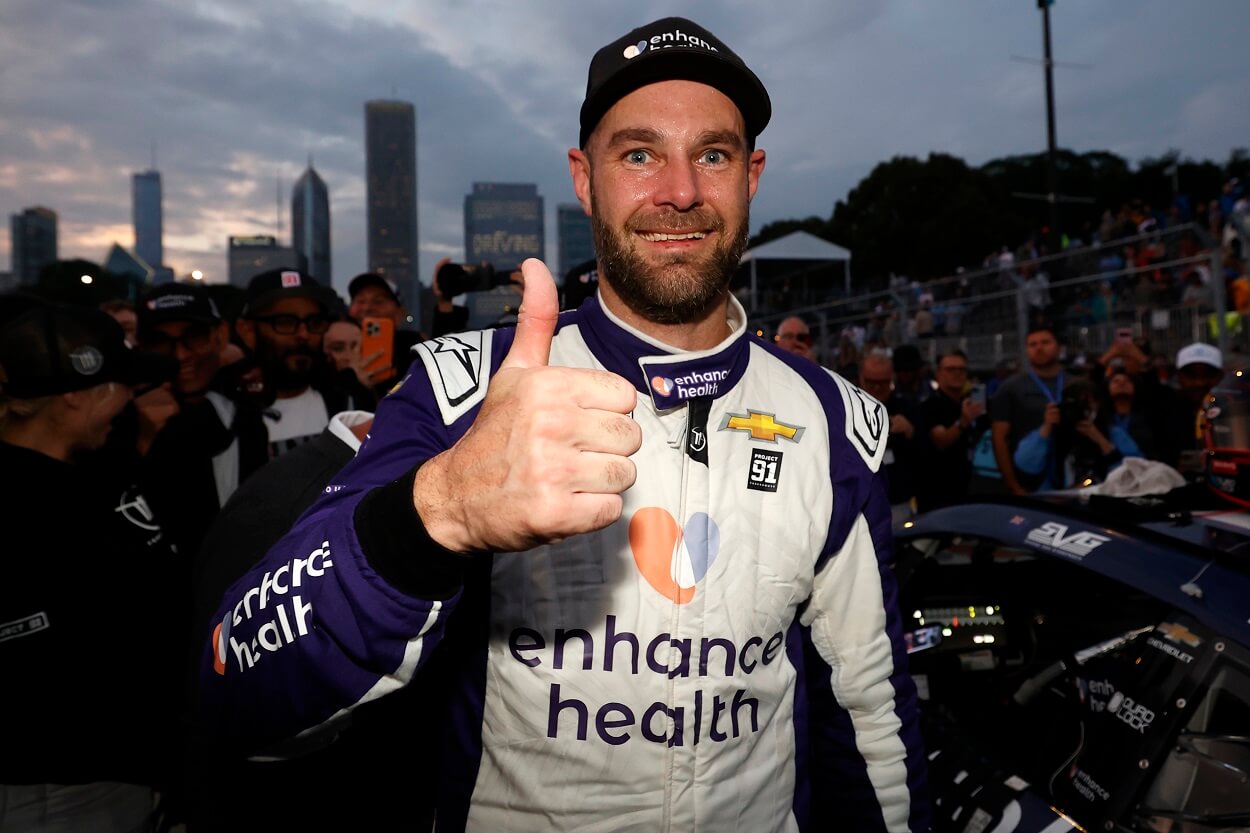 Shane Van Gisbergen, driver of the #91 Enhance Health Chevrolet, gives a thumbs up in victory lane after winning the NASCAR Cup Series Grant Park 220 at the Chicago Street Course on July 02, 2023 in Chicago, Illinois