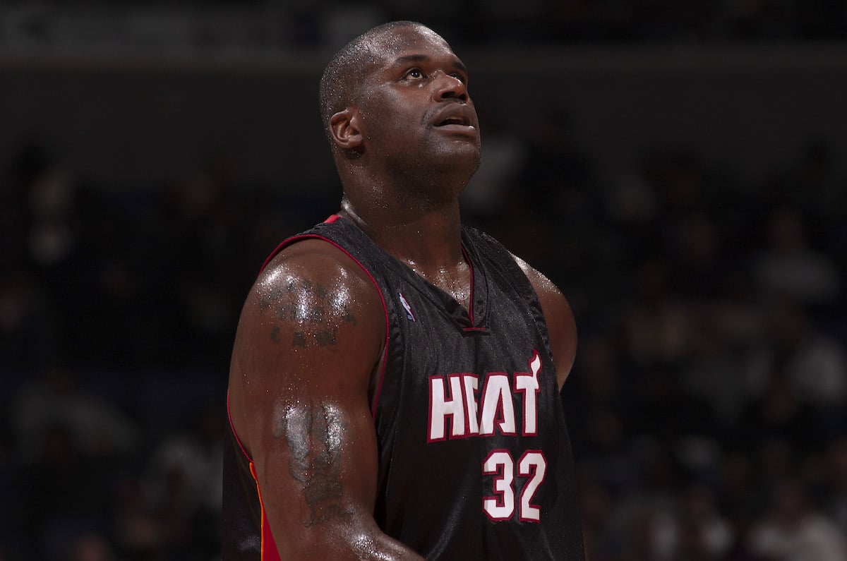 Shaquille O'Neal walks in a Miami Heat uniform.